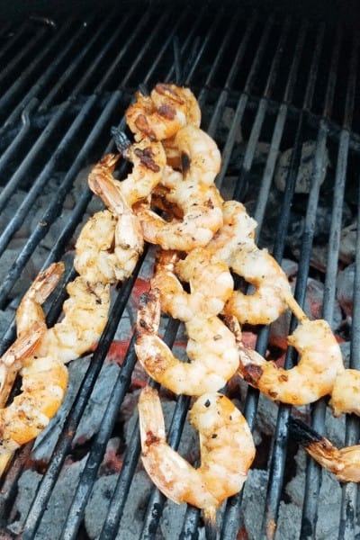 Blackened shrimp skewers on the grill.