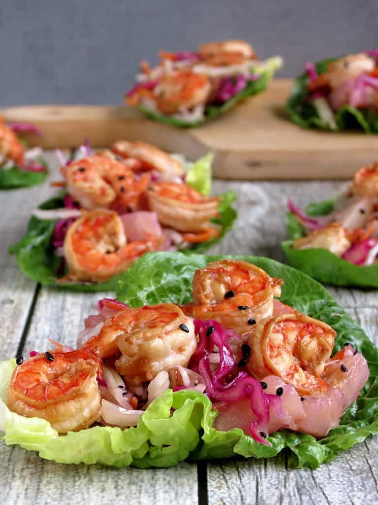 Lettuce wraps filled with shrimp and vegetables.