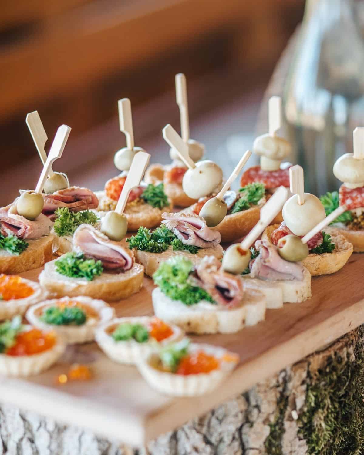 appetizers at a cocktail party on cutting board.