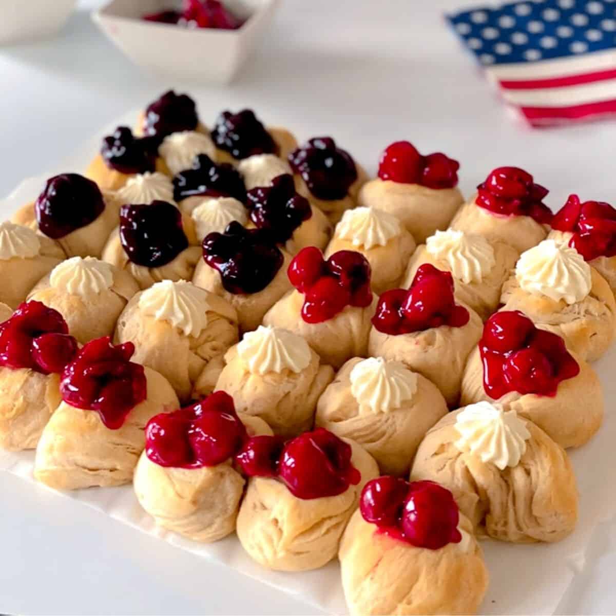 red, white and blue american flag dessert on table.
