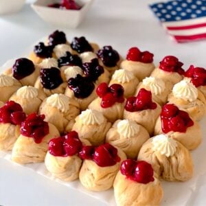 patriotic American flag dessert with red, white and blue topping on biscuits.