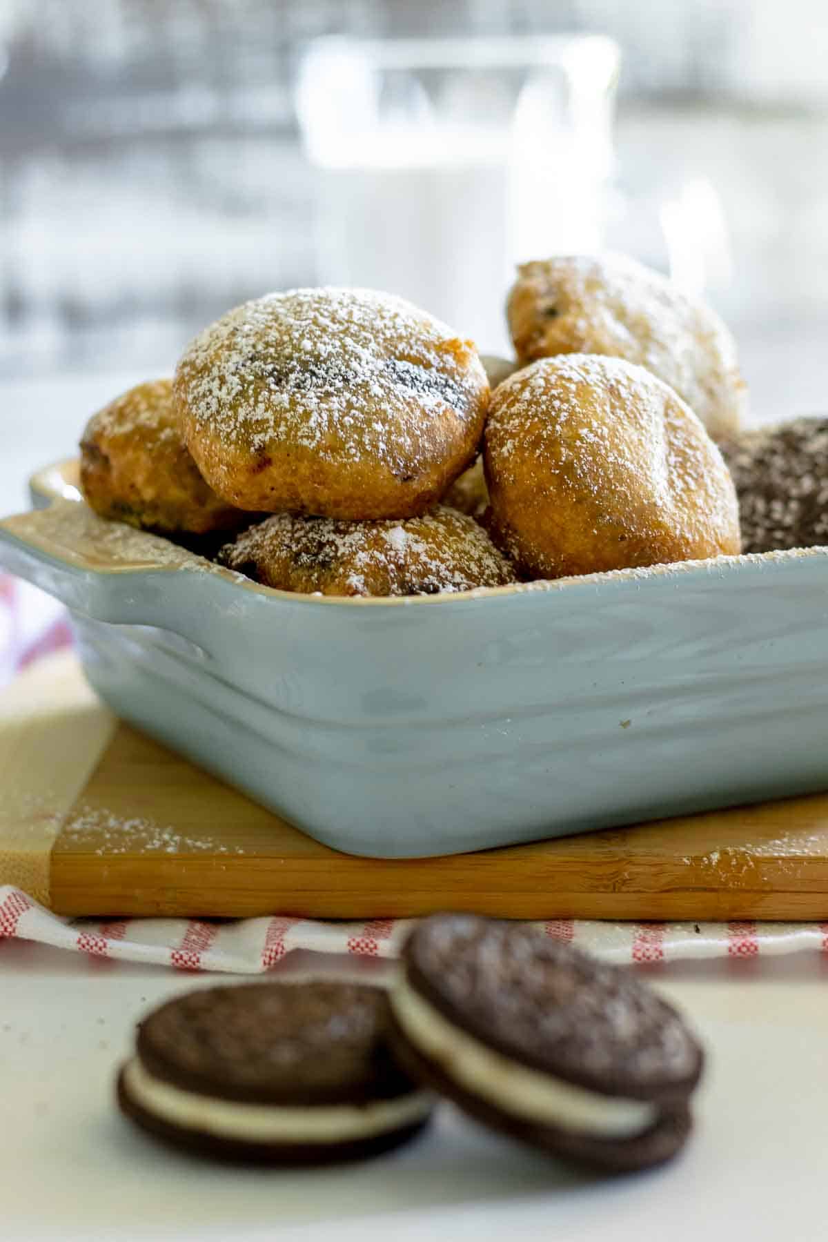 deep fried Oreo cookies without pancake batter on a table with milk.