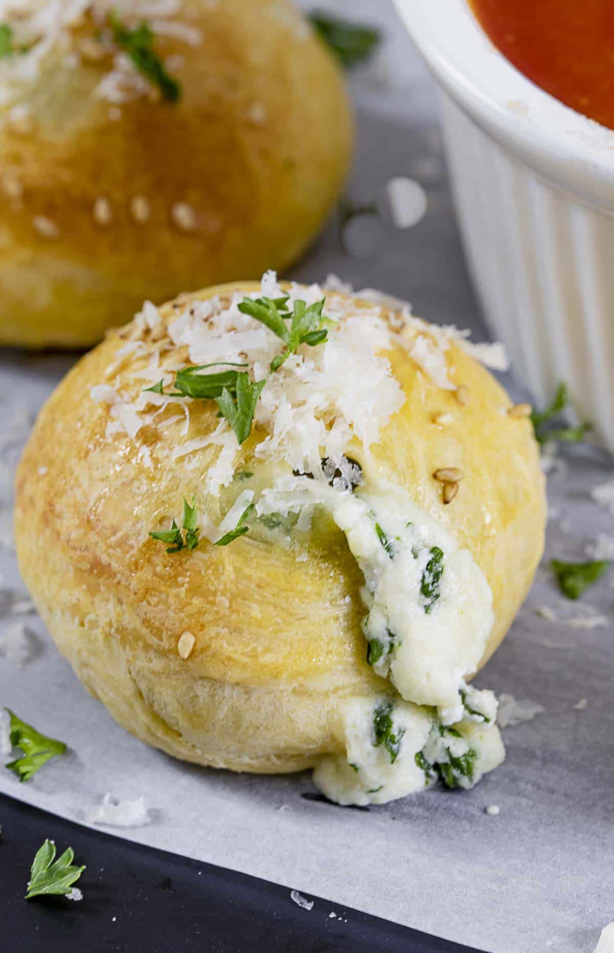 Close up of mini spinach calzone ball.