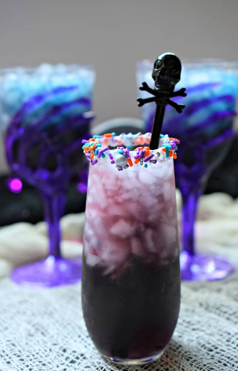 Purple cocktail for halloween with sprinkles.
