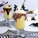 Vanilla Halloween milkshake for kids with eyes and bat wings.