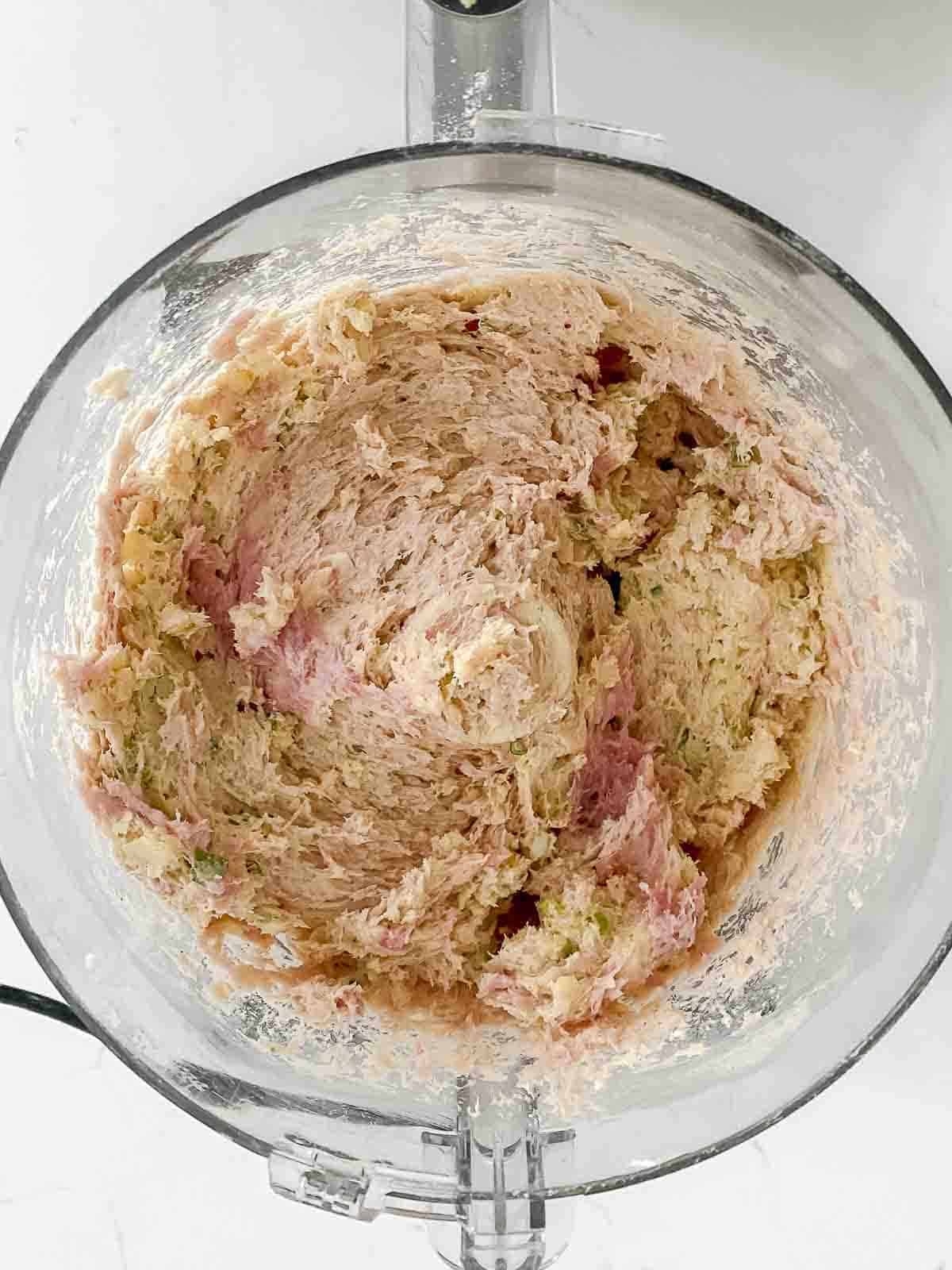 Sausage ball ingredients in a food processor pureed together.