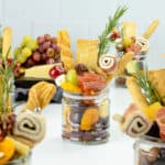 Charcuterie jars on table.