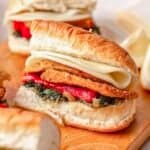 Vegetarian sandwich on table cut in half.
