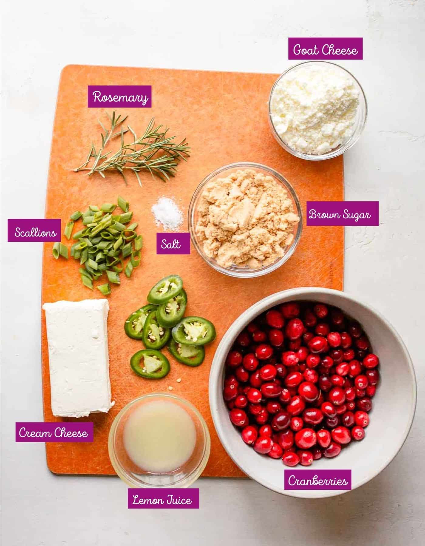 Ingredients on cutting board to make cranberry cream cheese balls appetizer.