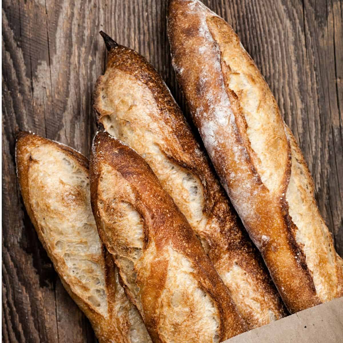 Long French baguettes on table.