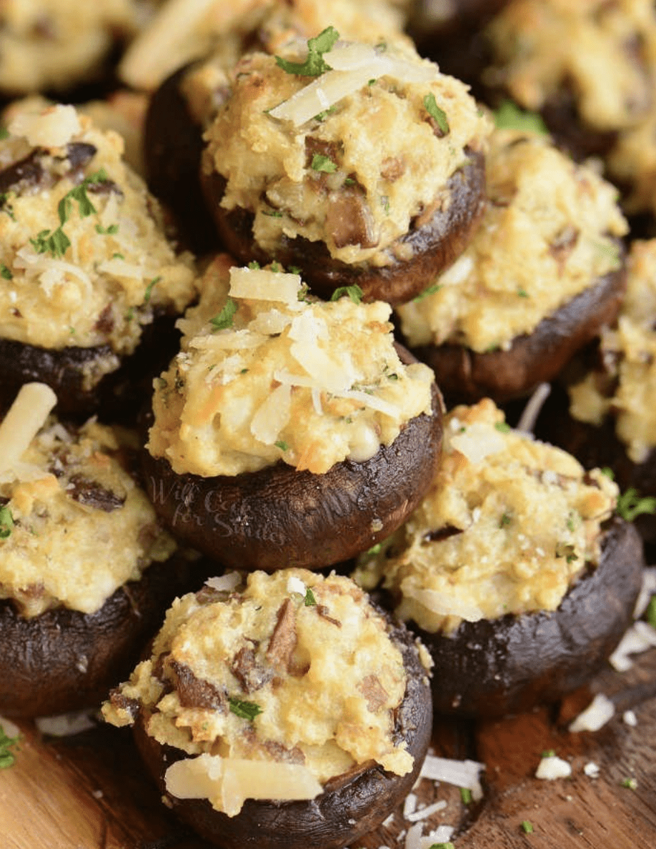 Pile of stuffed mushrooms with cheese.