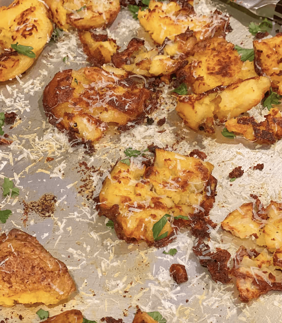 Smashed potatoes with parmesan cheese.
