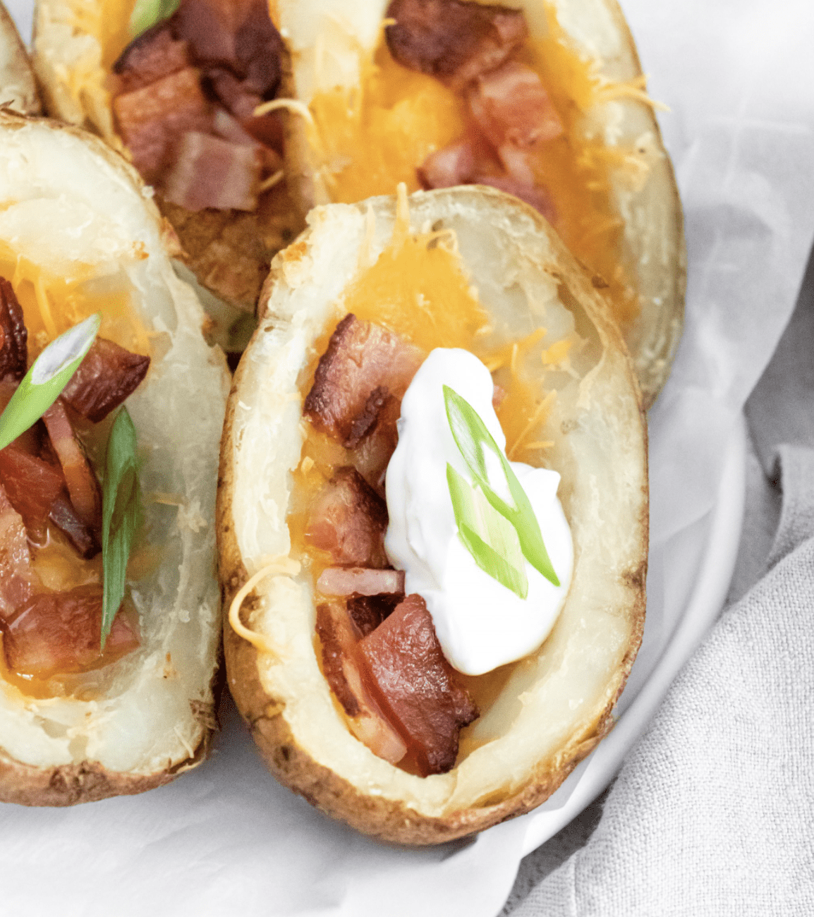 Loaded potato skins with bacon and sour cream.