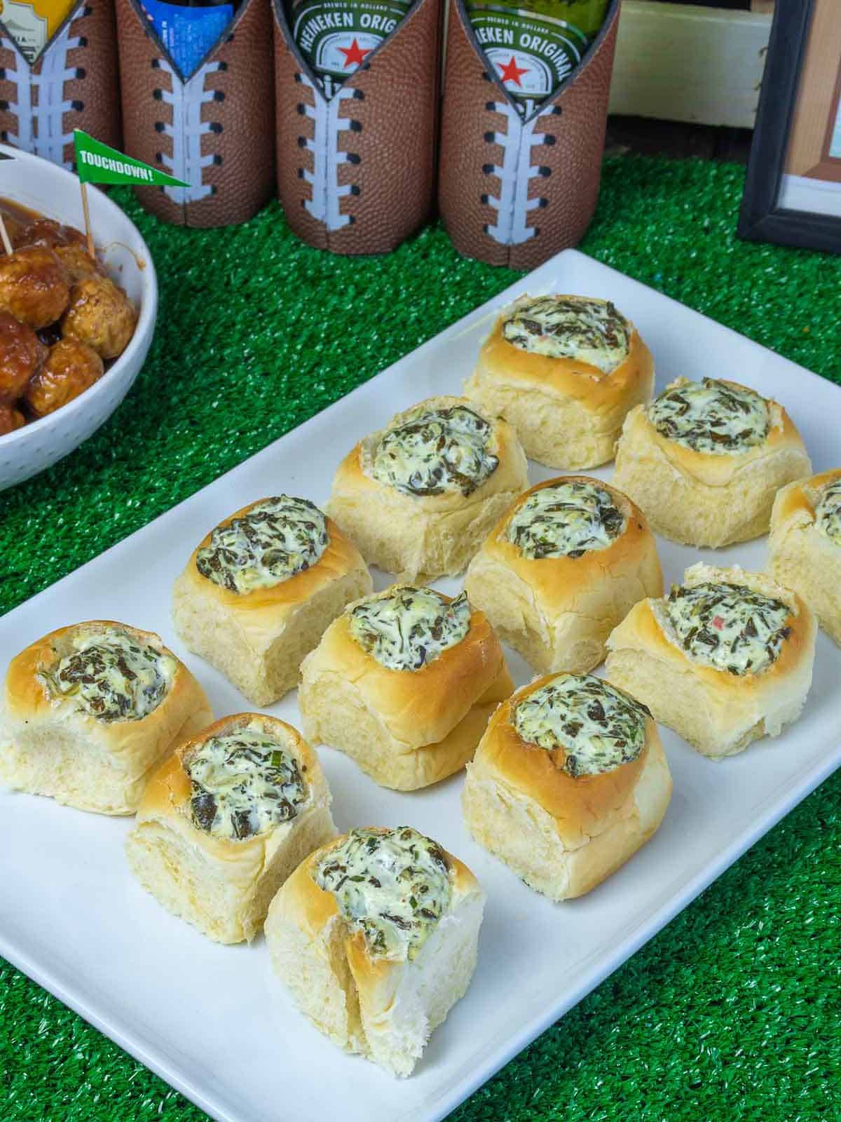 Super Bowl table with mini spinach dip bowls.