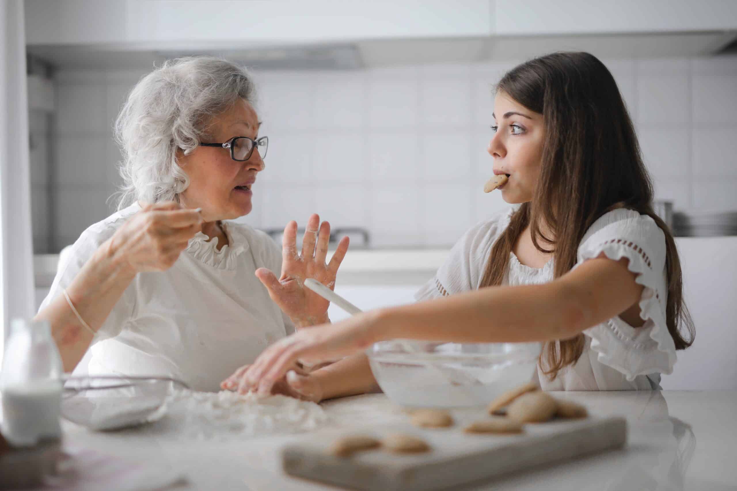 Mother and daughter baking cookies together.