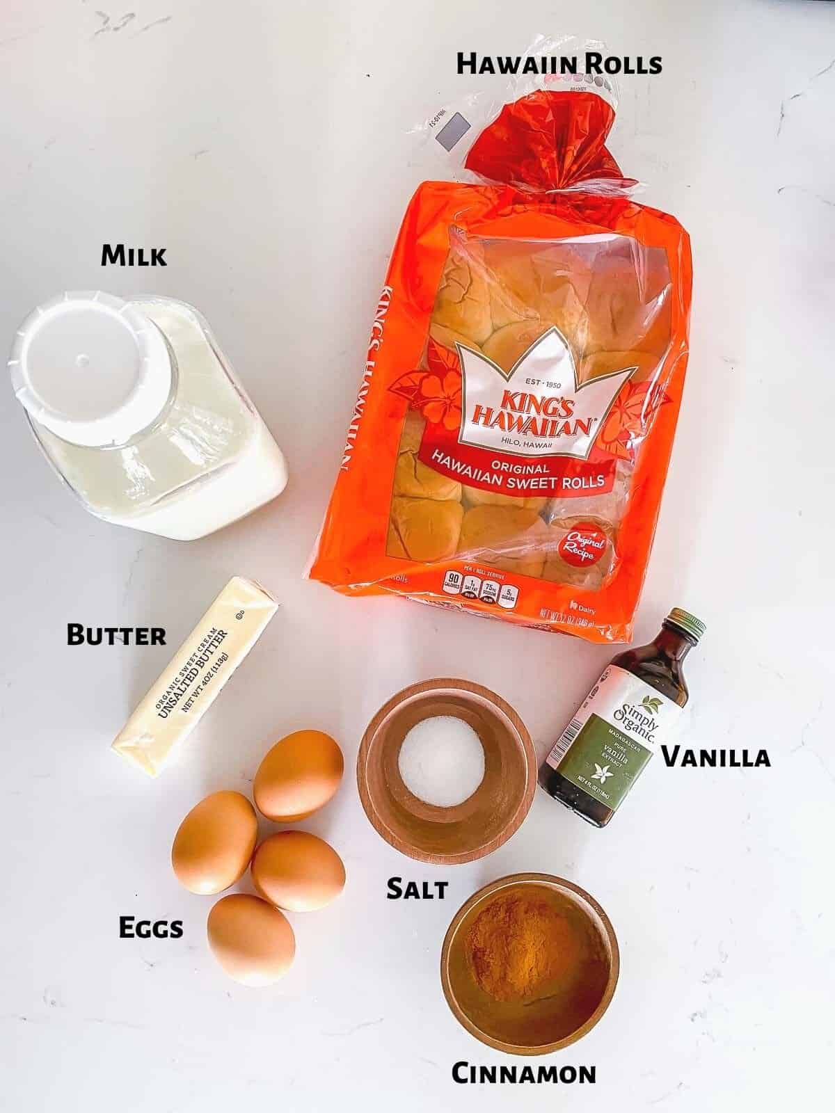 Ingredients to make sweet roll French toast on table.