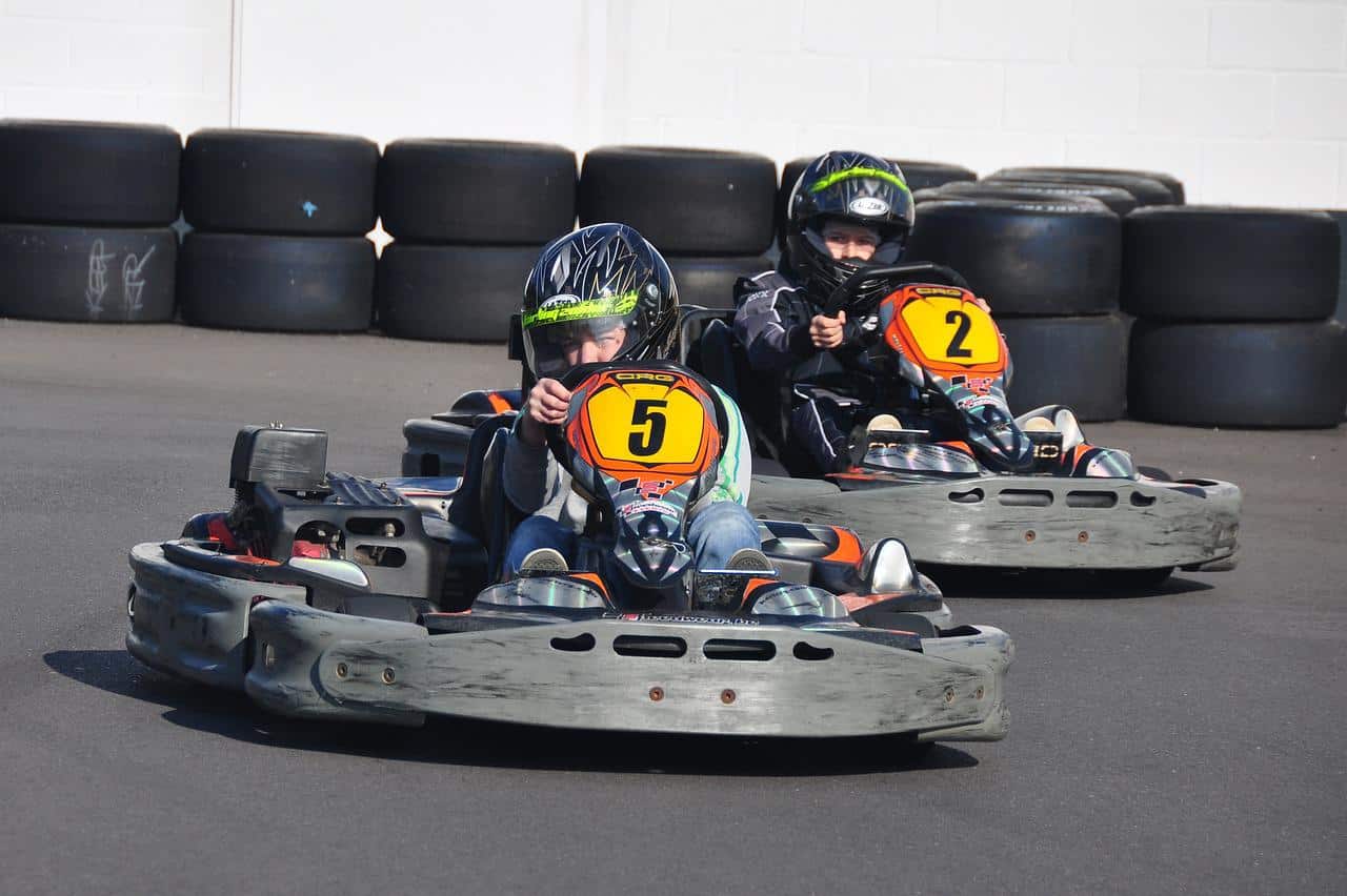 Two boys go-kart racing.