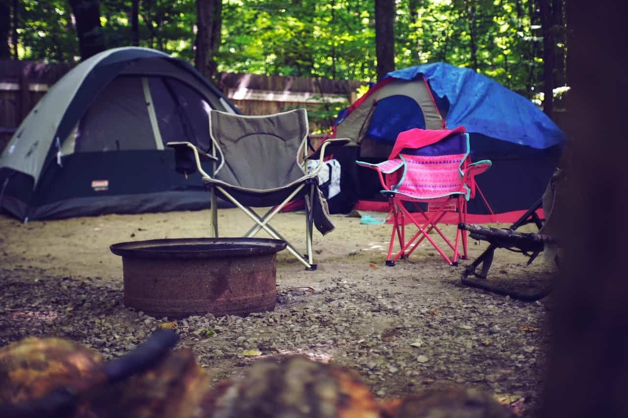 Two camping chairs and camping tents.