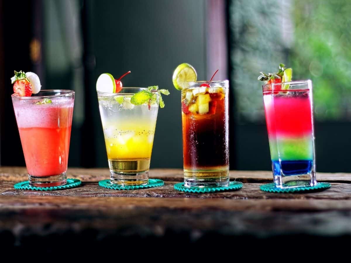 Vodka cocktails on table with garnishes.