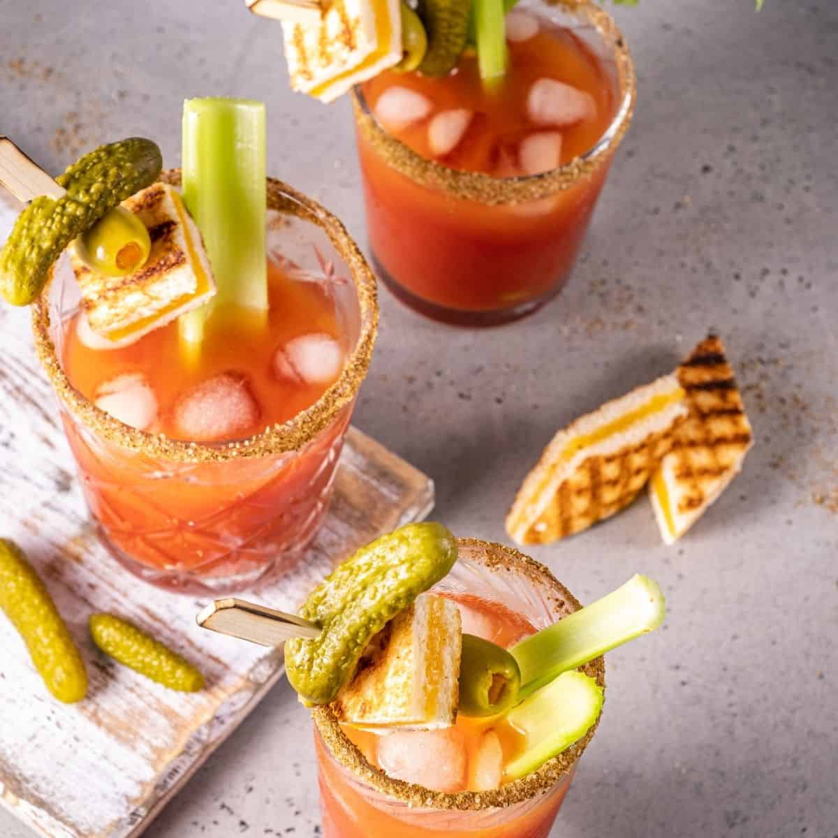 Bloody marys with celery, grilled cheese and pickles.