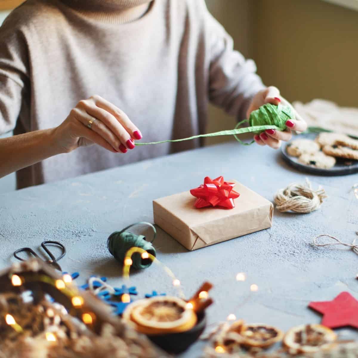 Woman wrapping Christmas gifts.