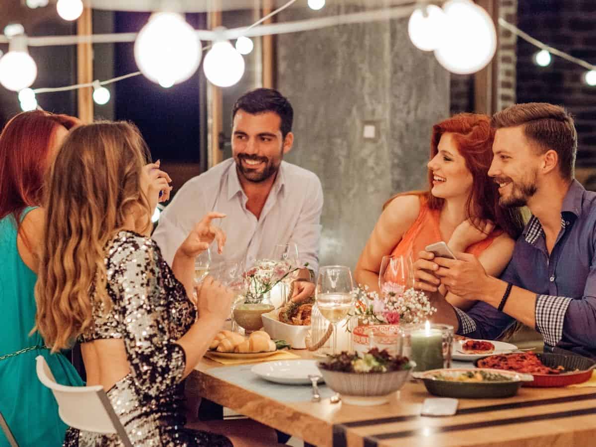 Image of adults enjoying drinks at a housewarming party.