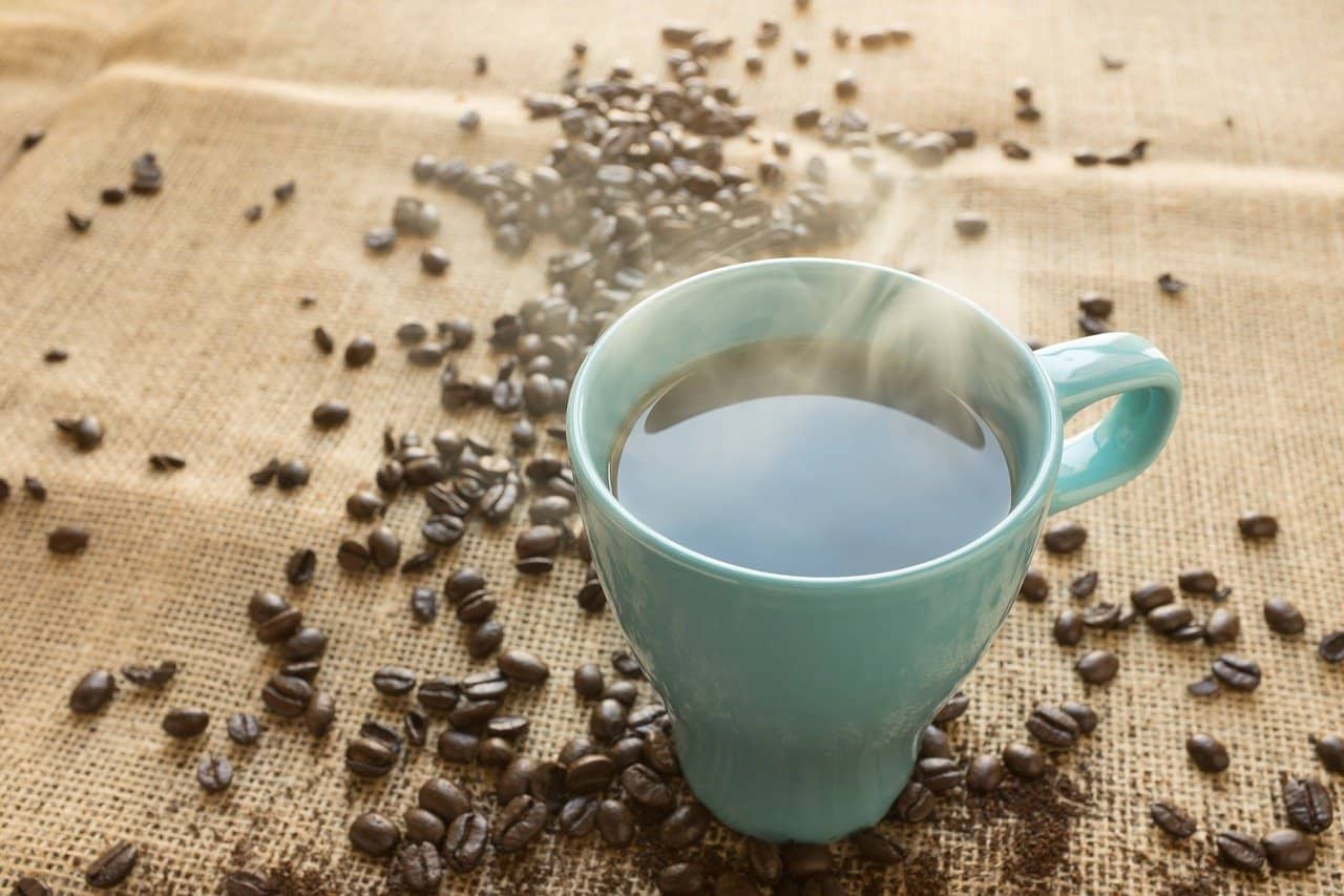 a steaming cup of coffee.