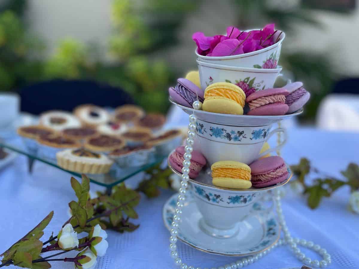 Tea cup tower of macarons and pearls.