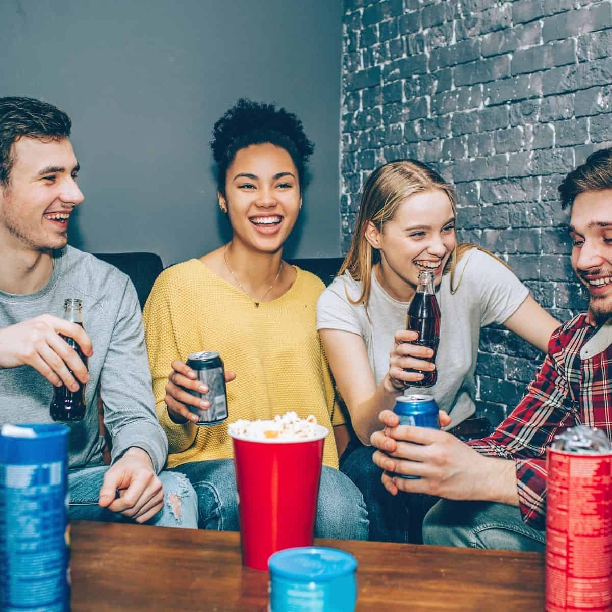 Adults having fun at party drinking.