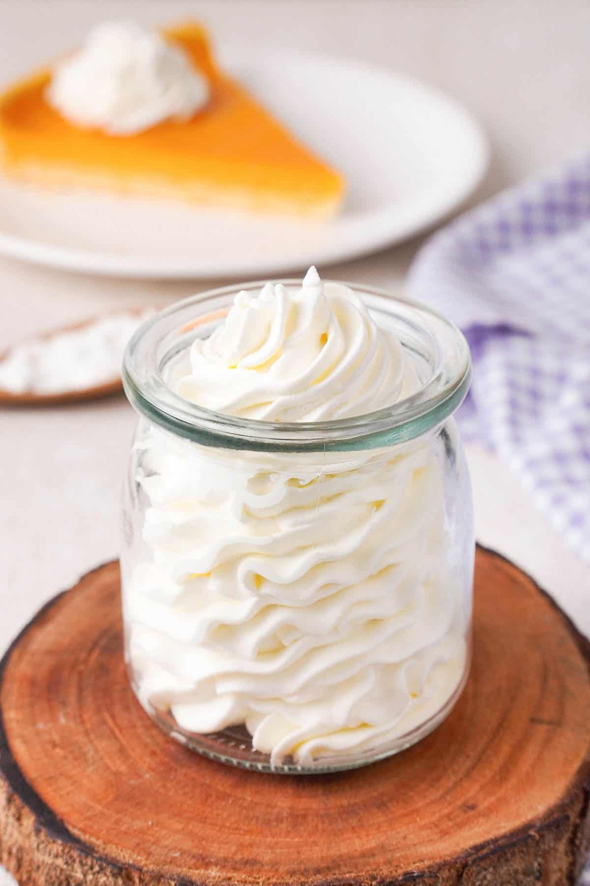 Bourbon whipped cream piped in a glass.