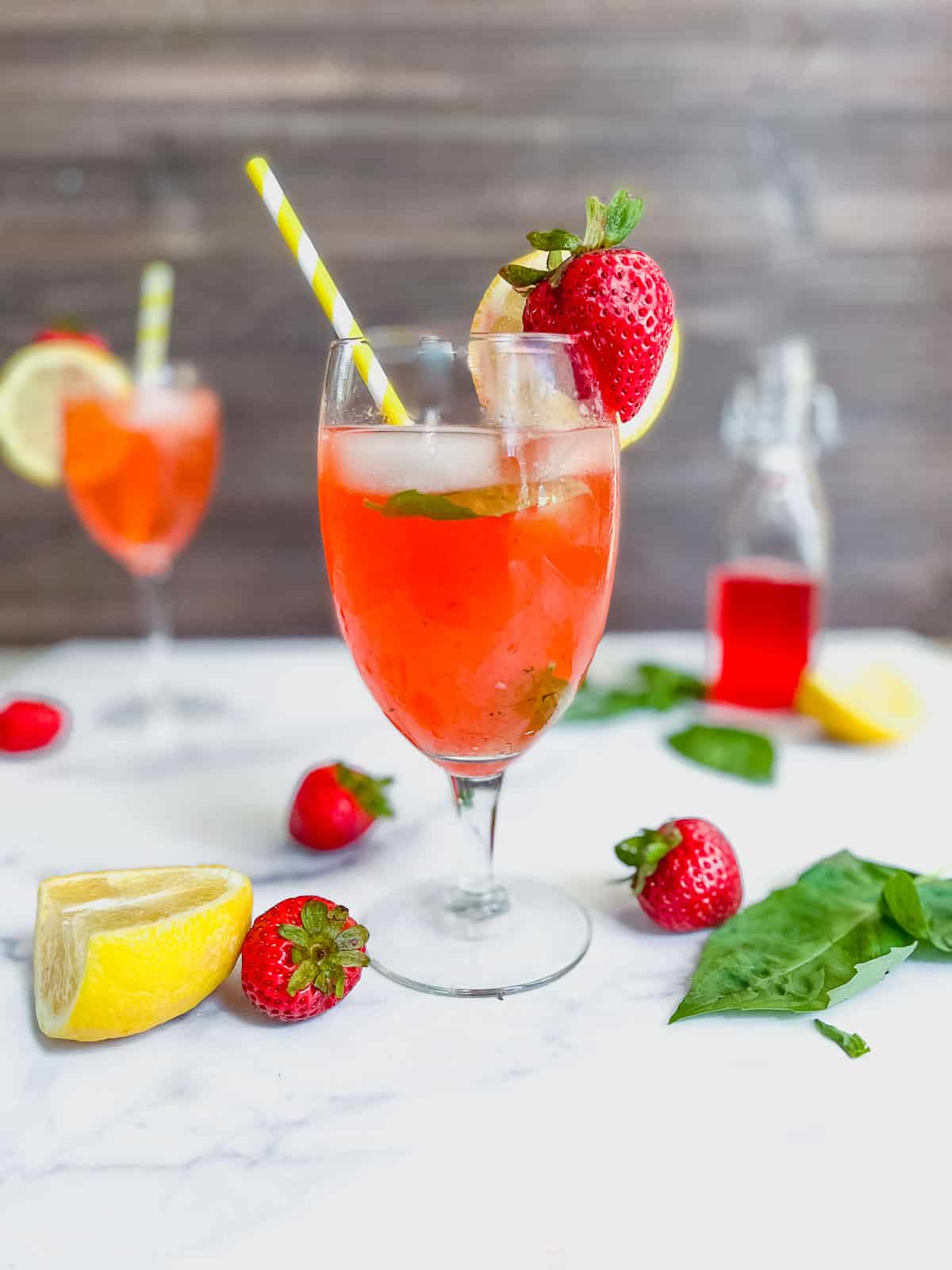Strawberry basil lemonade drink on table.