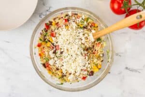 Veggies with cheese in a bowl.