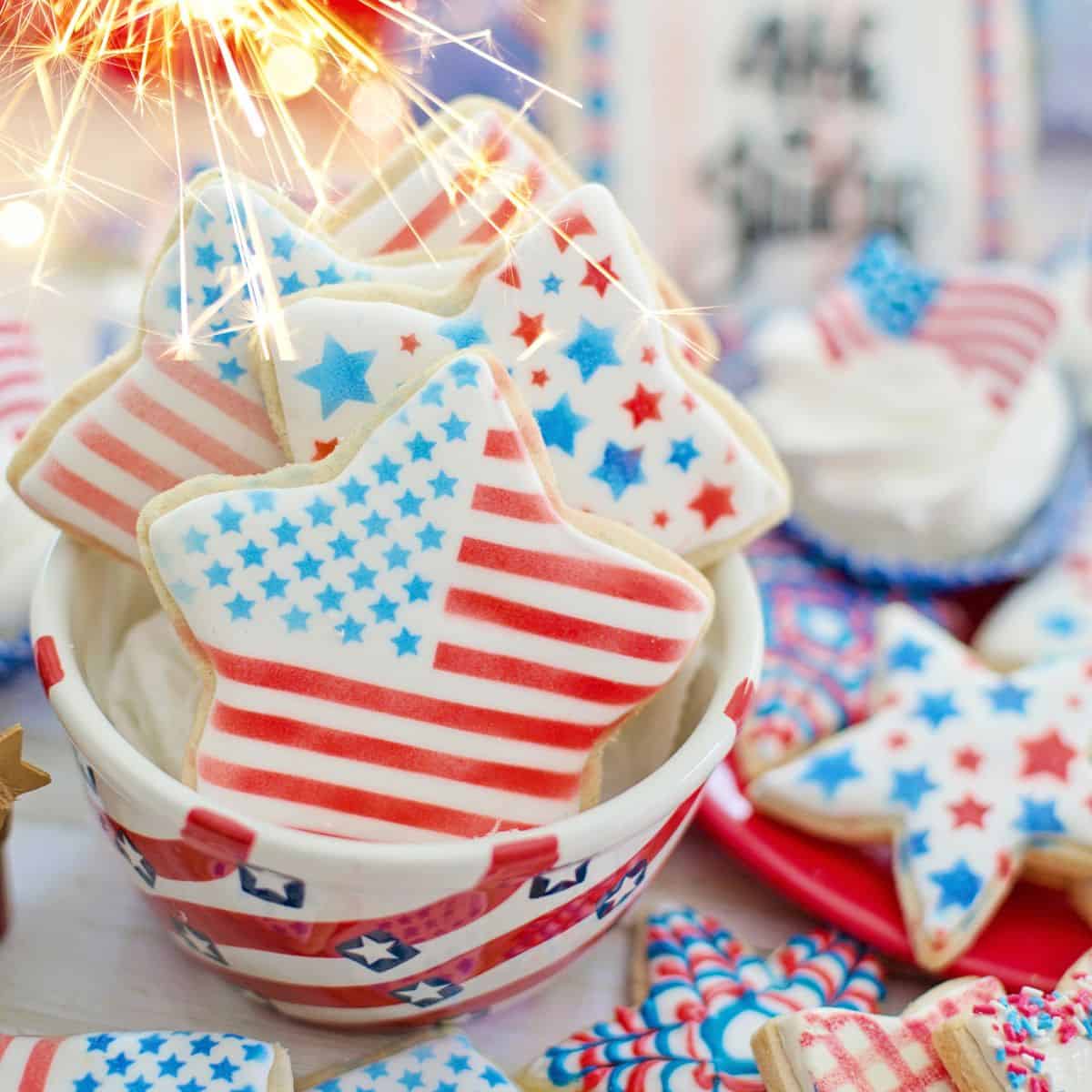 Red white and blue patriotic cookies on table.