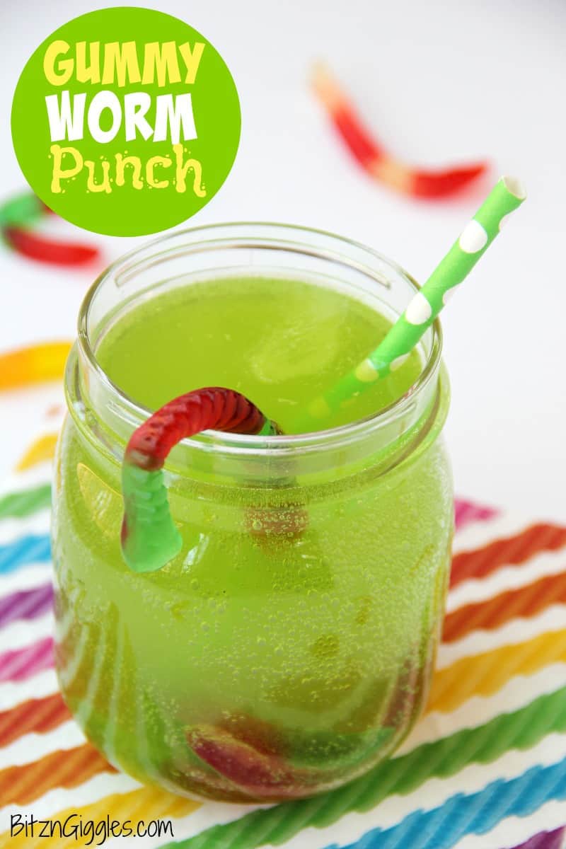 Green punch drink with gummy worms.