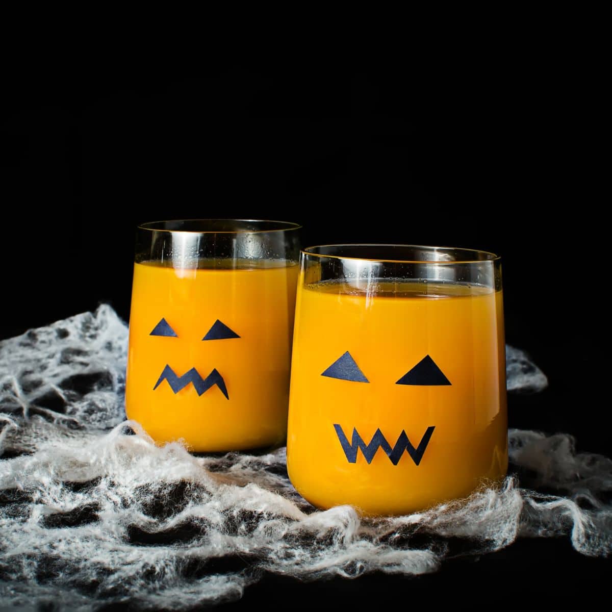 Hallween orange jack-o-lantern mocktails.