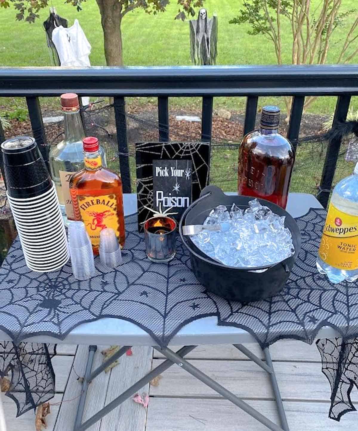 Drink table with booze for Halloween party.