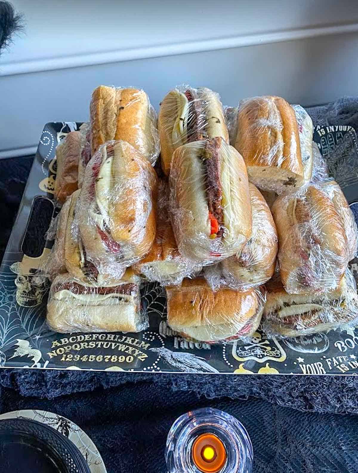 Wrapped primos sandwiches for party.