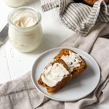 Brandy butter spread onto slice of bread.