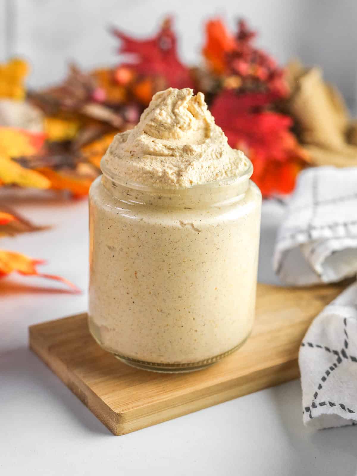 Pumpkin whipped cream in glass jar.