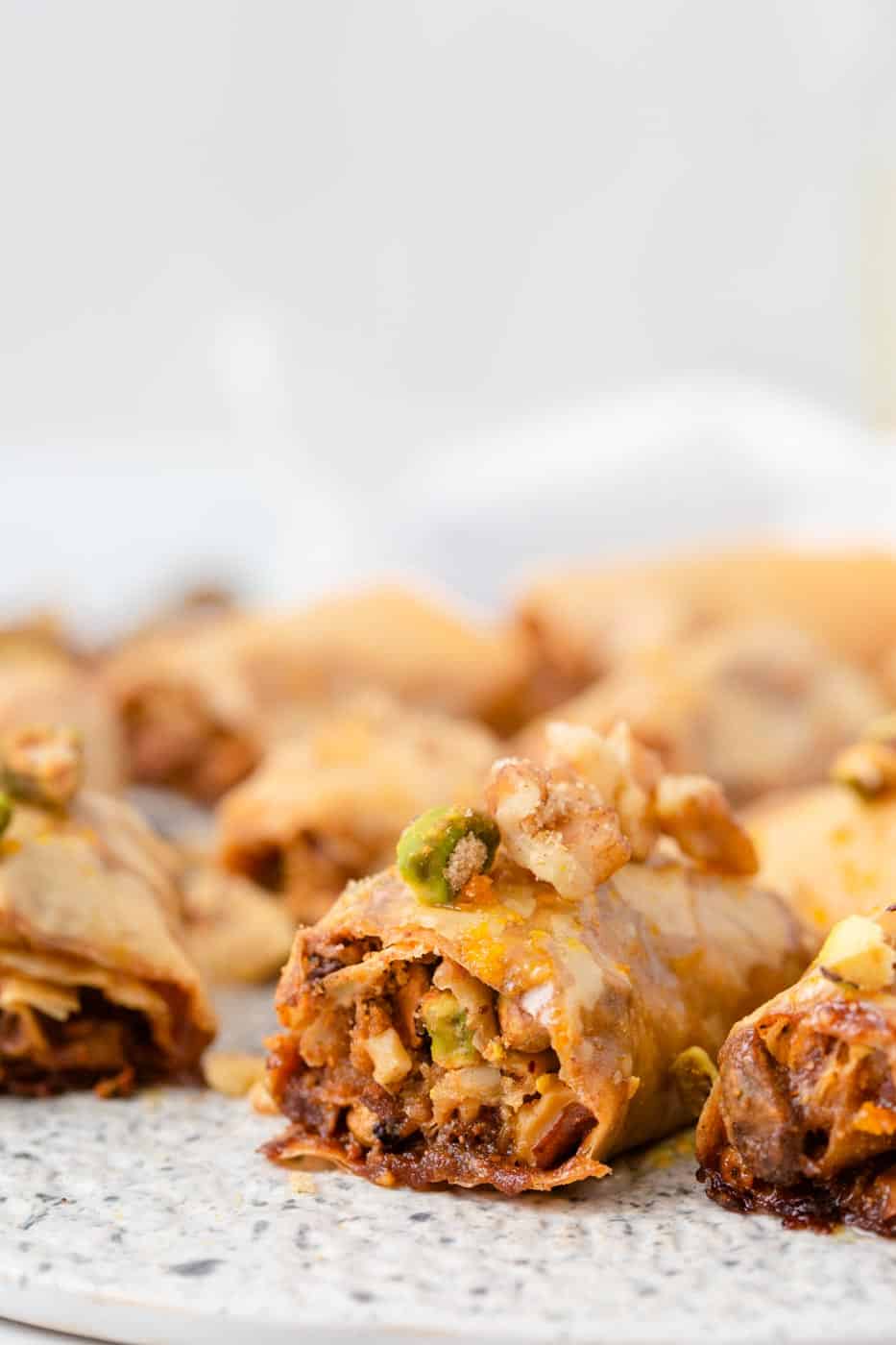 Baklava rolls on table.