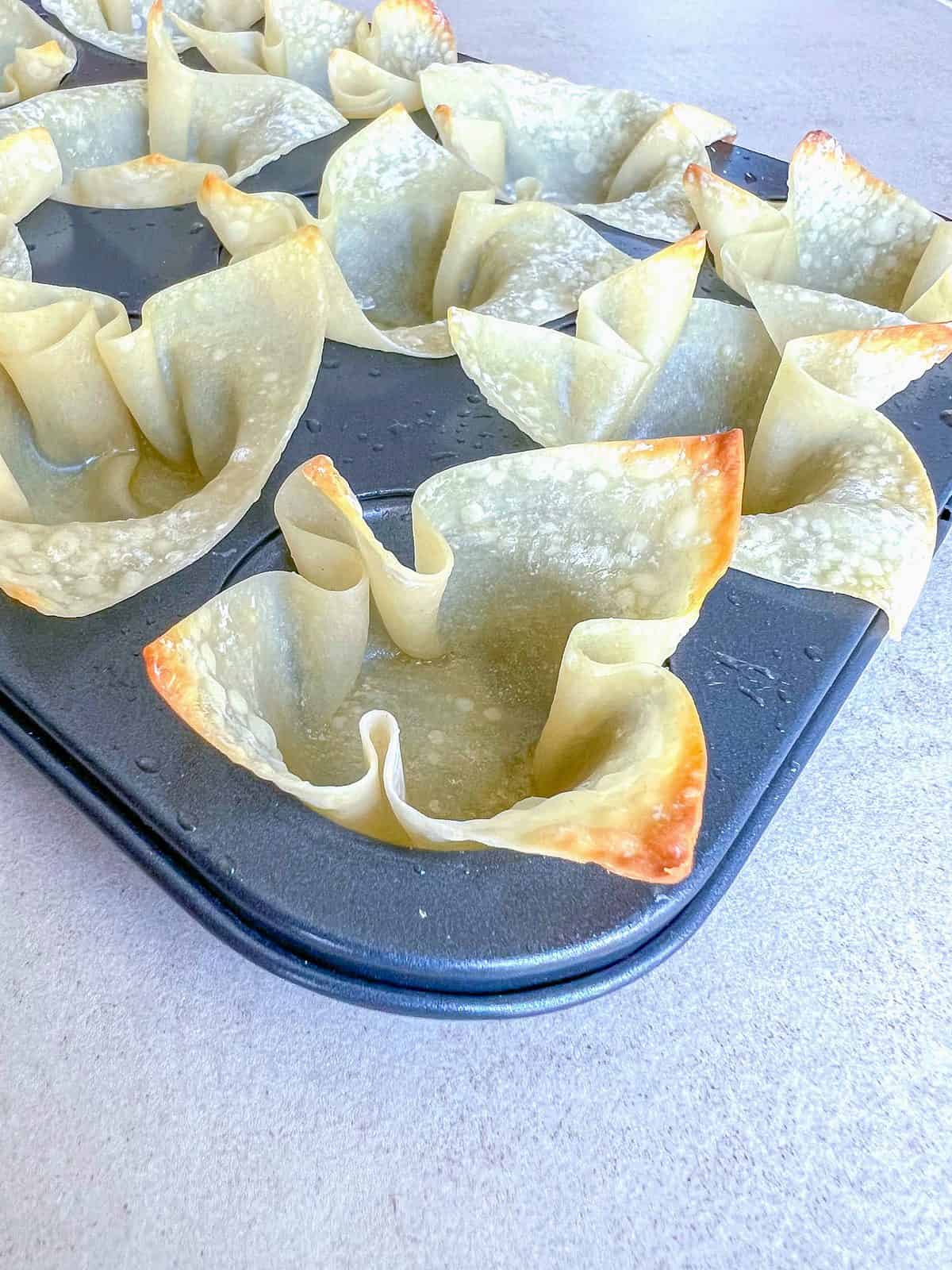 Wonton cups baked in a mini muffin tin.