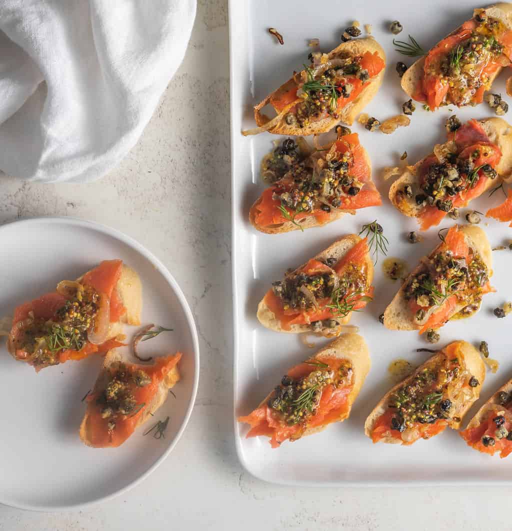 Smoked salmon crostini on platter.