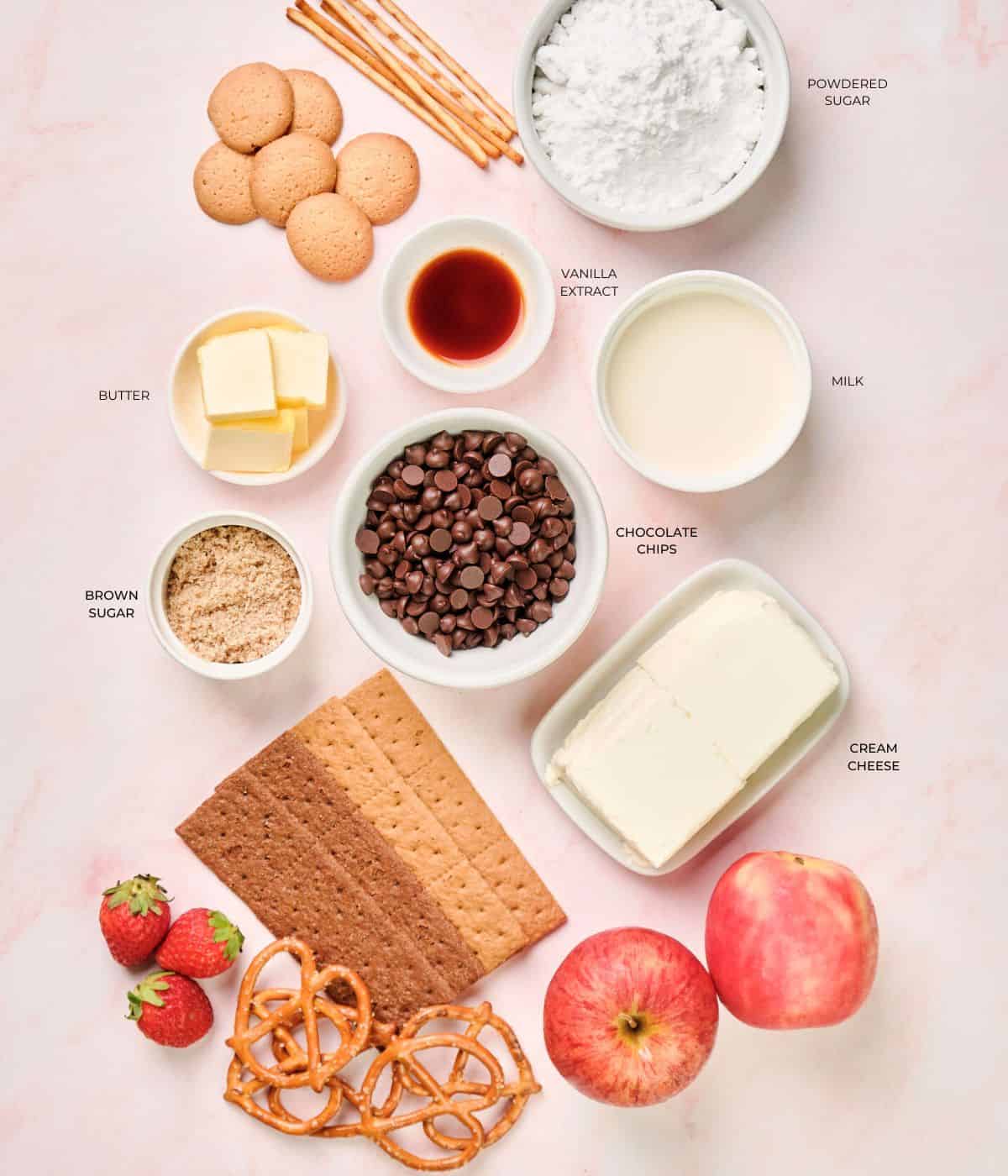 Ingredients to make chocolate chip dip on a table.