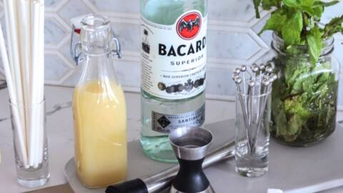 Preparation of a mojito cocktail by a bartender in a cafe. Summer cold