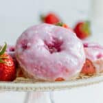 Strawberry donuts on a plate.