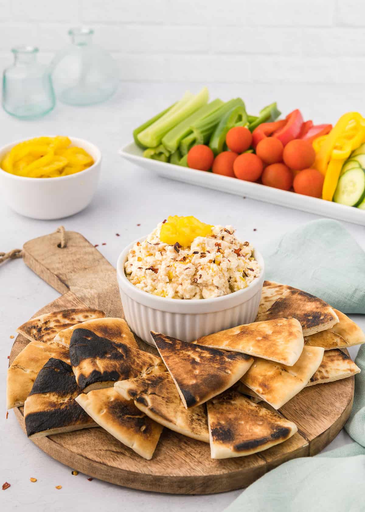 Spicy feta dip with pita on side.