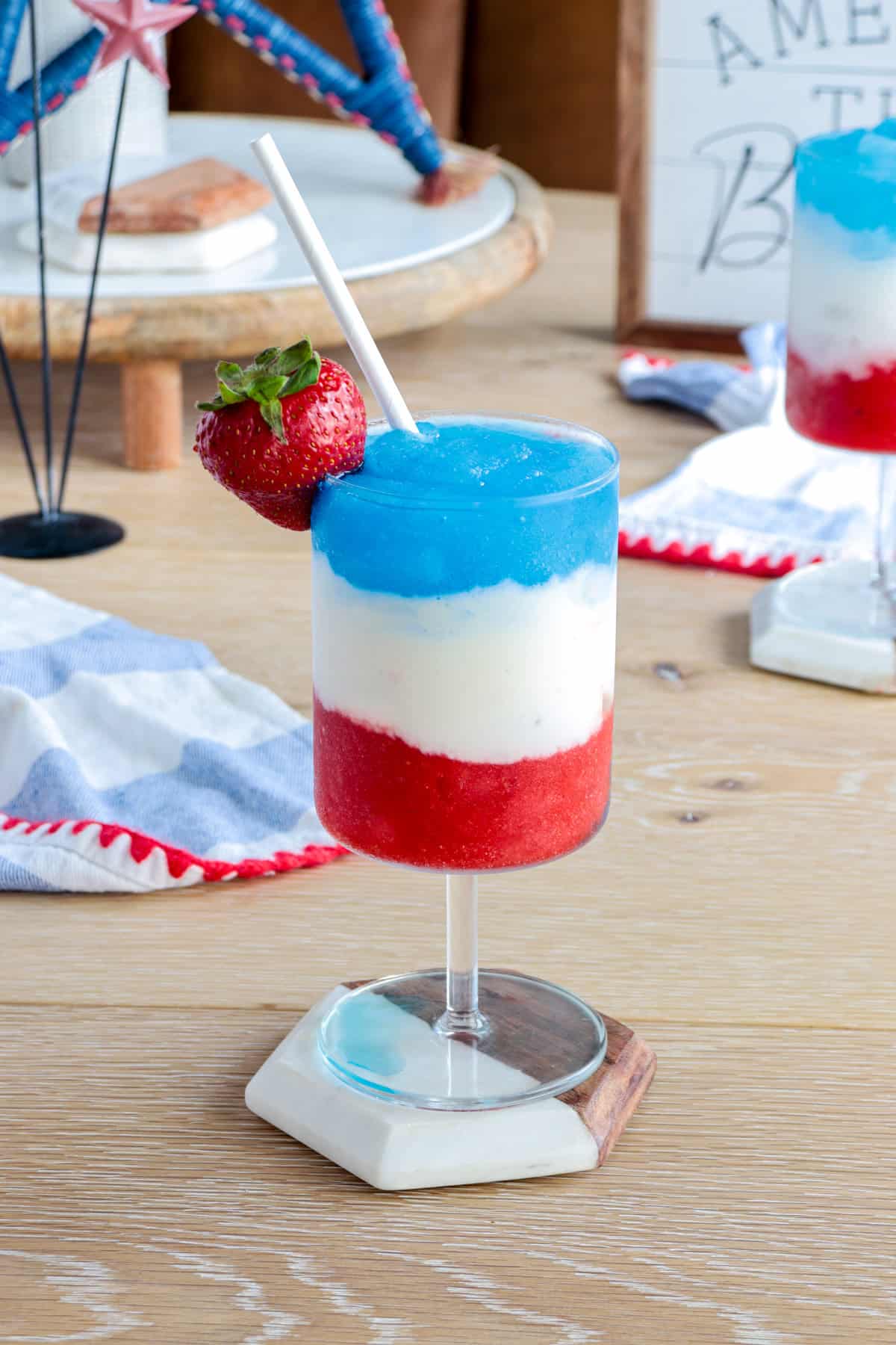 Layered july 4th drink frozen in glass.