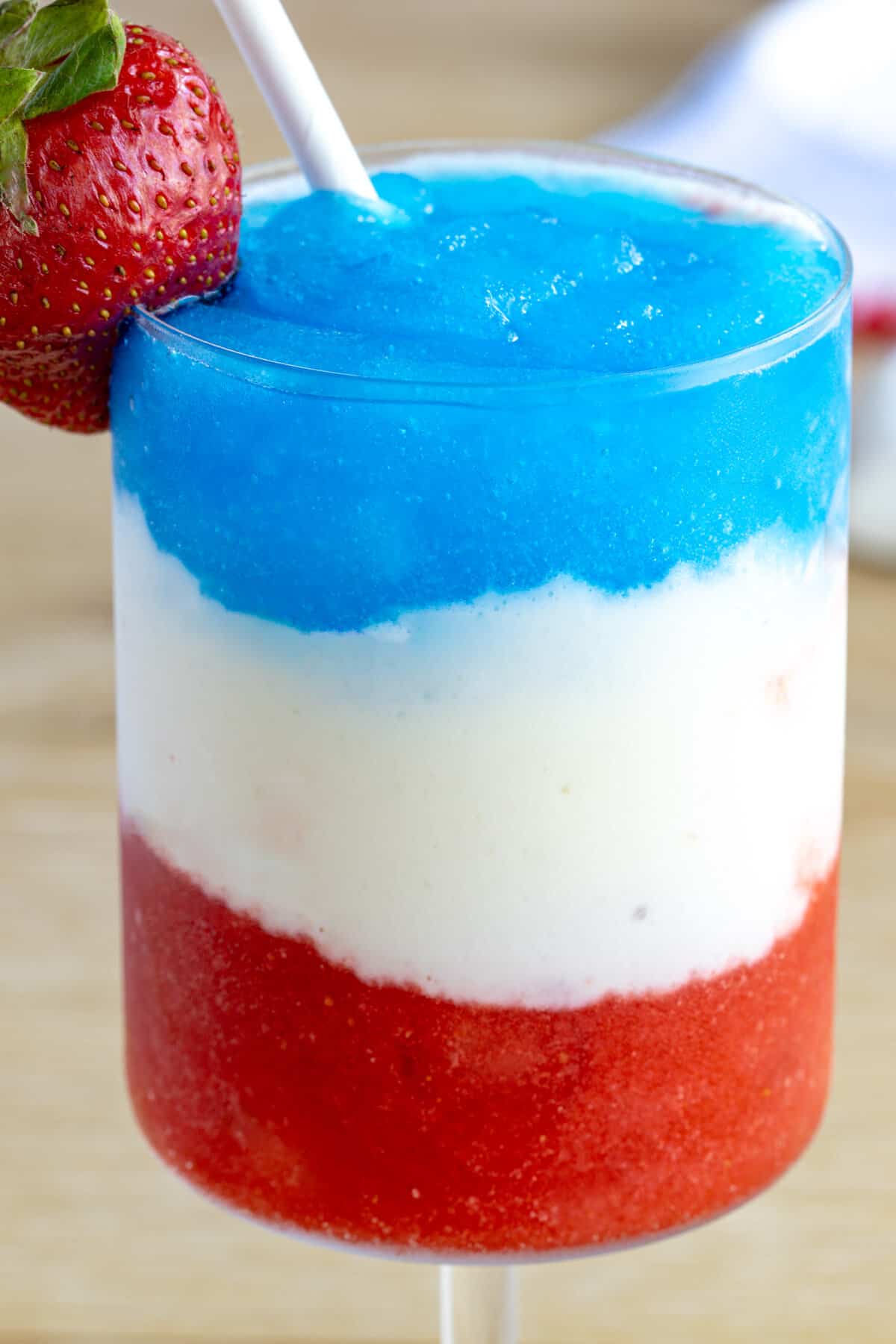 Layered red, white and blue cocktail for july 4th.