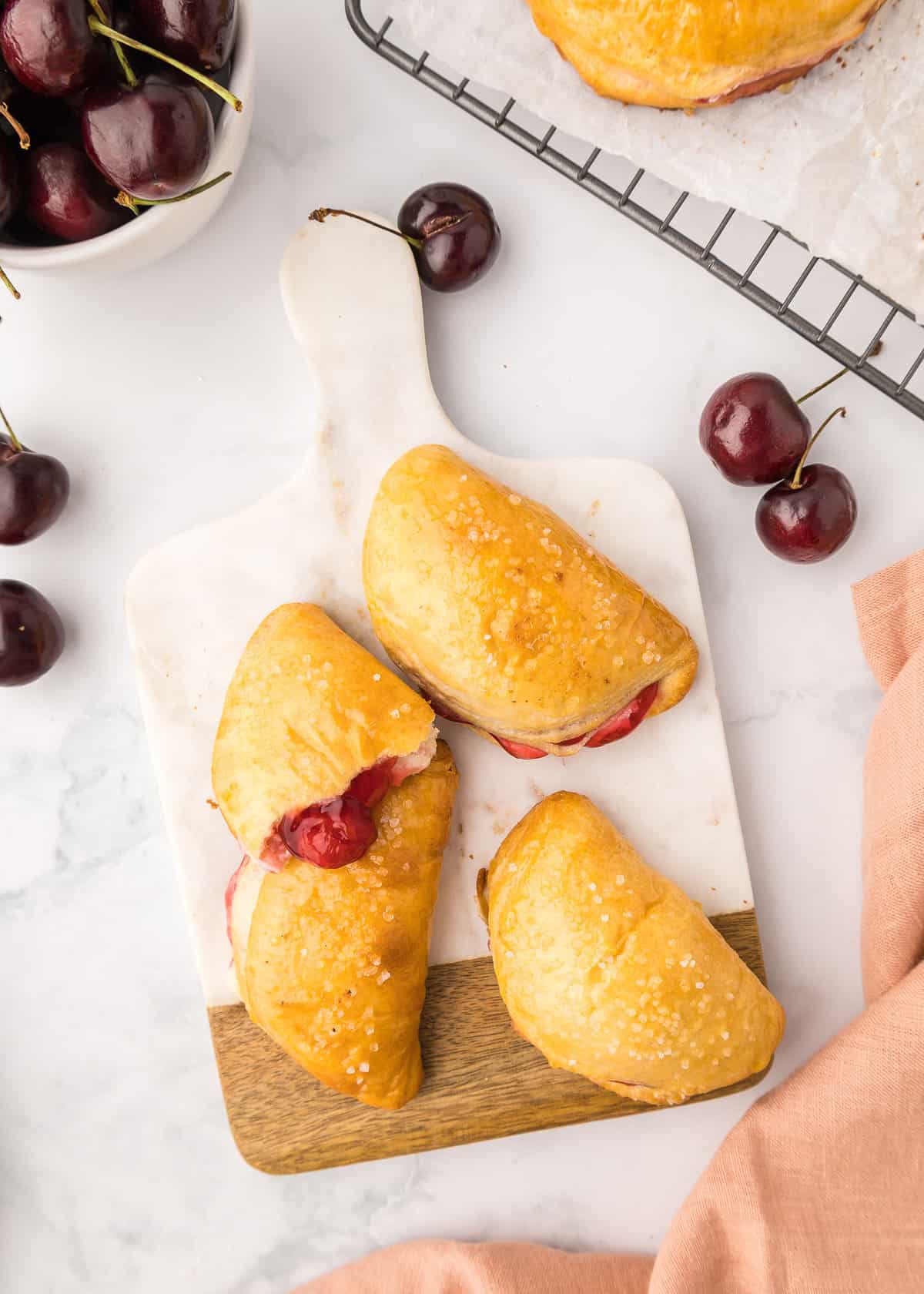 Cherry empanadas with cheesecake filling.