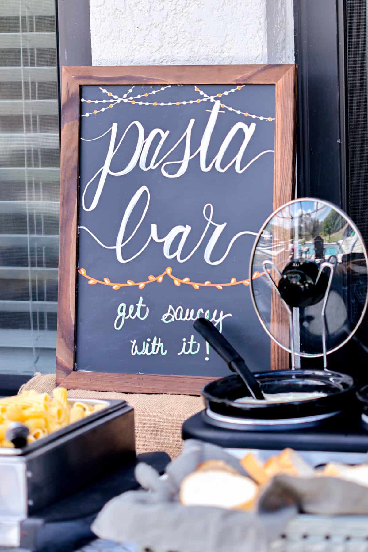 Pasta bar sign on table.